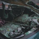 A broken windshield of a car
